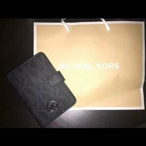 Michael Kors Passport case. New. Never used.